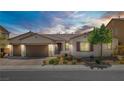 Charming single-story home featuring a three-car garage, desert landscaping, and great curb appeal at 9779 Mosaic Canyon Ct, Las Vegas, NV 89149