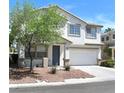 Charming two-story home with a two car garage, a well-manicured front yard, and mature landscaping at 9792 Cordova Vista Ct, Las Vegas, NV 89183