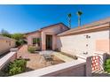 Inviting courtyard entrance with a small table and chairs offering a cozy outdoor space at 2037 Poppywood Ave, Henderson, NV 89012
