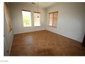 Bright bedroom with three large windows, tile floors, and neutral paint at 2324 Orangeburg Pl, Henderson, NV 89044