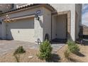 Inviting home with a two-car garage and stone-paved driveway and front entrance at 378 Rosefinch St, Henderson, NV 89012