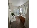 Well-lit bathroom with shower, single vanity, and stylish decor at 4107 Macadamia Dr, Las Vegas, NV 89115
