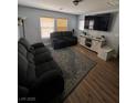 Cozy living room featuring comfortable seating and natural light at 4107 Macadamia Dr, Las Vegas, NV 89115