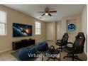 Virtually staged game room with comfy bean bags, gamer chairs, and large screen TV at 6457 Lovett Canyon St, Las Vegas, NV 89148