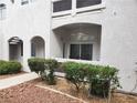 Attractive condo exterior with landscaped garden and private entrance and covered balcony at 700 Carnegie St # 2013, Henderson, NV 89052