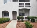 Inviting condo exterior with landscaped garden and private entrance and covered balcony at 700 Carnegie St # 2013, Henderson, NV 89052