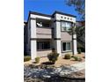 Exterior of condo featuring a charming two-story layout with a private balcony and stairs at 7255 W Sunset Rd # 2093, Las Vegas, NV 89113