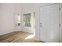 Bright entryway with wood flooring, white walls, and lots of natural light at 7624 Molfetta St, Las Vegas, NV 89149
