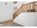 Elegant staircase with wooden railing and carpeted steps leading to the upper level at 7624 Molfetta St, Las Vegas, NV 89149