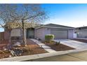 Charming single-story home featuring a well-maintained lawn, mature trees, and a two-car garage at 7913 Rushmore Ave, Las Vegas, NV 89131