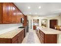 Spacious kitchen with custom cabinets, granite countertops, stainless steel appliances, and a large island at 7913 Rushmore Ave, Las Vegas, NV 89131