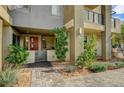 Inviting townhouse showcasing a brick walkway, small yard, and a stylish front entrance at 1541 Unison Way # 102, Las Vegas, NV 89135
