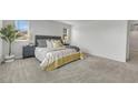 Bright and airy bedroom with plush carpeting, neutral walls, and large windows at 160 Lilt Ave, Henderson, NV 89011