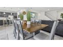 Dining room featuring a wooden table, seating for eight, and tile flooring at 160 Lilt Ave, Henderson, NV 89011