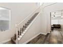 Bright entryway with hardwood floors and a staircase leading to the second floor at 2664 Strichen Ave, Henderson, NV 89044