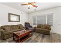 Inviting living room with comfortable seating and wood-look floors at 2664 Strichen Ave, Henderson, NV 89044