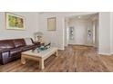 Bright living room with hardwood floors, fresh paint, and natural light illuminating the space at 2913 Laverton Dr, Las Vegas, NV 89134