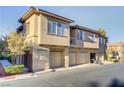 Well-kept condo building features garages and tidy landscaping at 3915 Palm Beach St # 201, Las Vegas, NV 89129