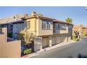 Charming condo building with private garages and desert landscaping at 3915 Palm Beach St # 201, Las Vegas, NV 89129
