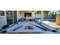 Backyard featuring a pool table, swimming pool, and covered patio, perfect for recreation at 5318 Palmyra Ave, Las Vegas, NV 89146