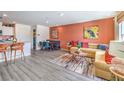 Inviting open-concept living space featuring stylish decor and seamlessly connected dining and kitchen areas at 7405 Harmon Falls Ct # 1093/226, North Las Vegas, NV 89084