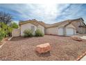 Single-story home with minimal landscaping, neutral exterior, three-car garage at 8301 Shad Bush Ave, Las Vegas, NV 89149