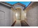 Covered entry with custom metal security gate and side windows at 8301 Shad Bush Ave, Las Vegas, NV 89149