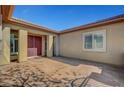Inviting front entrance featuring a decorative concrete landing, double doors and neutral colors at 8370 Unicorn St, Las Vegas, NV 89131