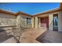 Inviting front entrance featuring a decorative concrete landing, double doors and neutral colors at 8370 Unicorn St, Las Vegas, NV 89131