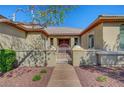 Inviting front entrance with a well-maintained walkway and decorative gate at 8370 Unicorn St, Las Vegas, NV 89131
