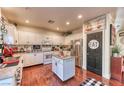 Bright kitchen with white cabinets, stainless steel appliances, and a center island at 9692 Waukegan Ave, Las Vegas, NV 89148