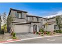 Beautiful two-story home with a tile roof, attached garage, and low-maintenance landscaping at 9993 Birch Knoll Ave, Las Vegas, NV 89166