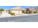 Wonderful home featuring a two-car garage, tile roof, and tidy desert landscaping at , Las Vegas, NV 89130