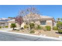 Inviting single-story residence featuring desert landscaping, mature trees and neutral color palette at , Las Vegas, NV 89130