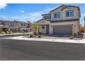 View of a modern two-story home with a neutral color scheme, two car garage, and low maintenance landscaping at 10367 Andele Ave, Las Vegas, NV 89166