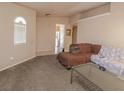 Cozy living room with neutral carpet, neutral paint, and lots of space at 1636 Royal Palm Dr, Las Vegas, NV 89128