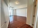 Bright bedroom featuring gleaming hardwood floors and floor-to-ceiling window with city views at 200 W Sahara Ave # 3909, Las Vegas, NV 89102
