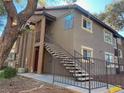 Apartment exterior featuring stairs leading to upper units with neutral color scheme at 2750 S Durango Dr # 2027, Las Vegas, NV 89117