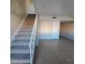Inviting living room showcases a carpeted staircase and neutral decor at 3417 Civic Center Dr # B, North Las Vegas, NV 89030