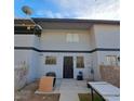 Inviting condo showcasing stucco siding, dual pane windows, and a manicured backyard at 3420 Mercury St # H, North Las Vegas, NV 89030