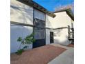 Inviting condo showcasing stucco siding, dual pane windows, and a manicured front yard at 3420 Mercury St # H, North Las Vegas, NV 89030