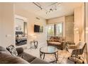Modern living room featuring a comfortable seating area, exposed concrete, and a view to the bedroom at 353 E Bonneville Ave # 439, Las Vegas, NV 89101