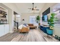 Bright living room featuring hardwood floors, modern furnishings, and ample natural light at 4634 English Lavender Ave, North Las Vegas, NV 89031