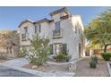 Charming two-story home with a neutral color palette, landscaped yard and entry walkway at 5081 Pine Mountain Ave, Las Vegas, NV 89139