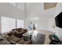 Spacious living room with vaulted ceiling, neutral color palette, and plenty of natural light at 5081 Pine Mountain Ave, Las Vegas, NV 89139