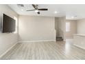 Spacious living room featuring a ceiling fan, and modern flooring at 7486 River Dove Ct, Las Vegas, NV 89139