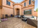 Stamped concrete patio with outdoor seating area, perfect for relaxing and entertaining guests at 8348 Nelson Ridge Ln, Las Vegas, NV 89178