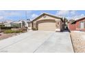 Charming home featuring a stone facade, two-car garage, and drought resistant landscaping at 1713 Diamond Oaks Ct, Las Vegas, NV 89117