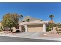 Single-story home featuring well-maintained desert landscaping and a spacious two-car garage at 2739 Darby Falls Dr, Las Vegas, NV 89134