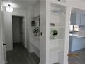 Bright entryway with built-in shelving for storage and decor that flows into the kitchen at 3484 Nightflower Ln # 2, Las Vegas, NV 89121